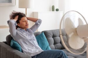 Woman cooling down from sweating.