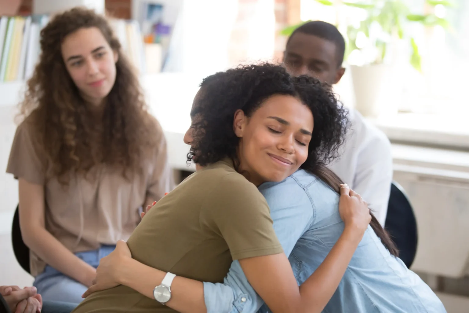 People hugging during a group session