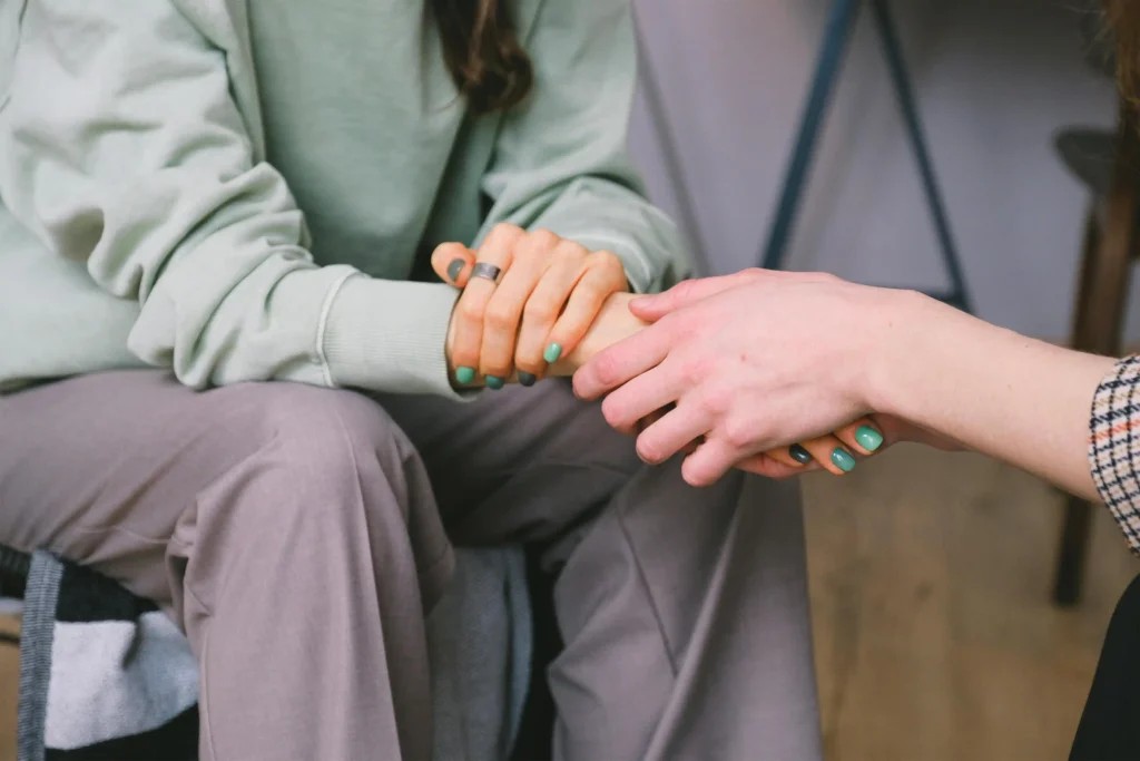 Two people holding hands