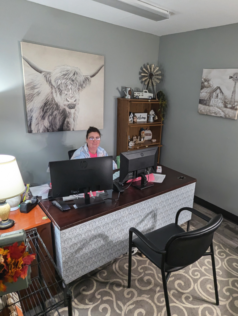 Woman sitting behind her desk in an office