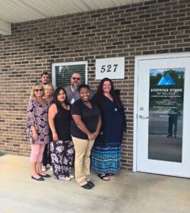 The Stepping Stone of Wilkes team in front of the facility