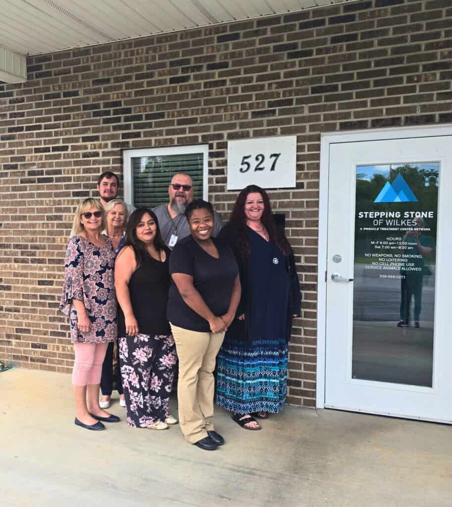 The Stepping Stone of Wilkes team in front of the facility