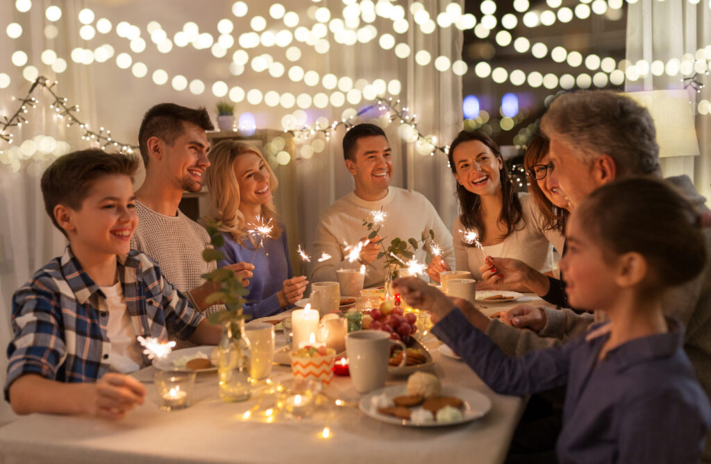 A family sitting around a table for a meal.