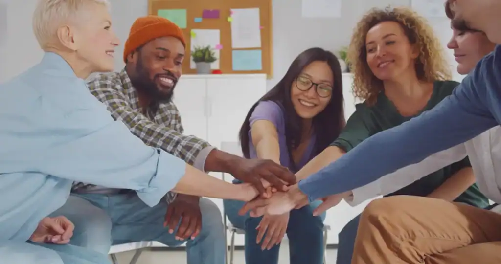 everyone with hands in the middle
