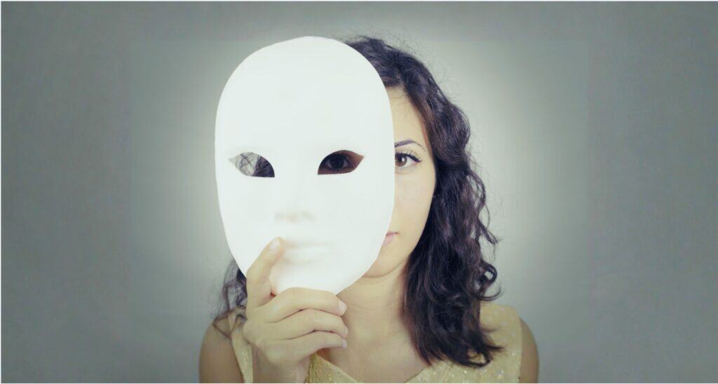 Woman taking a mask off