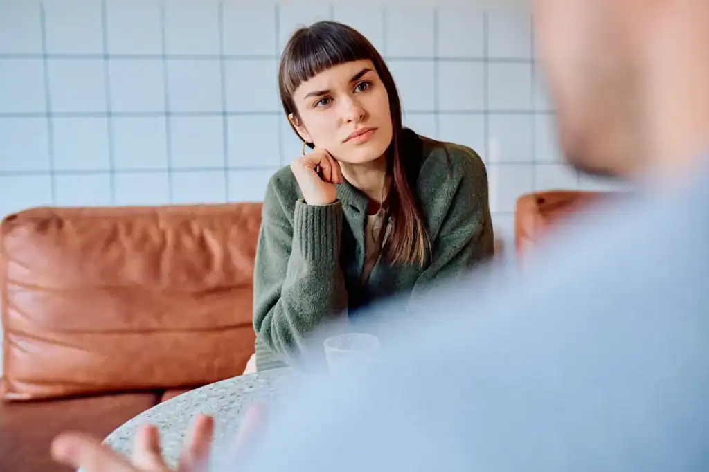 woman sitting and talking with practitioner