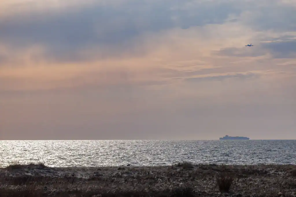coastal view of the ocean from the sandy shore